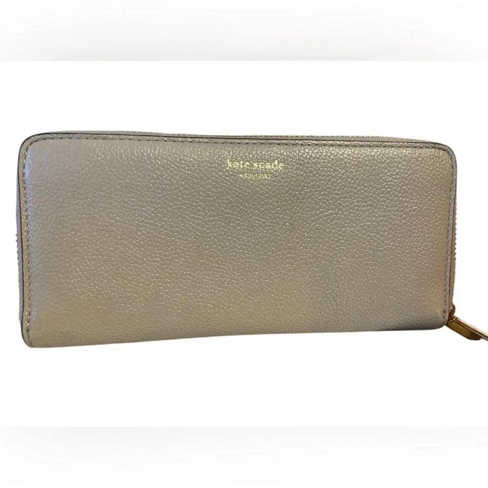 Kate Spade zip around wallet gold embossed branding
